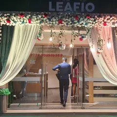 The entrance to the Leafio hotel, decorated for a wedding reception. We created a beautiful floral arch with hanging greenery and lights over the main doors to welcome guests.