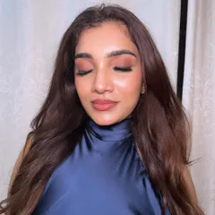 A close-up of the "glazed skin" look with eyes closed. You can see the beautiful, natural sheen on the high points of the face, achieved through careful skin prep and highlighting.
