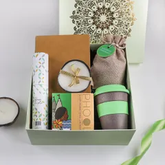 An eco-friendly Diwali hamper for the conscious consumer. This gift includes sustainable items like a reusable coffee cup, Phool incense made from temple flowers, and a soy wax candle.