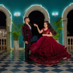 Another angle of this romantic dance, showing how the ruffled layers of the red ball gown add texture and volume, making it a stunning choice for a pre-wedding celebration.