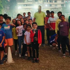 A happy group of our young athletes posing with their coaches. This picture captures the strong sense of community and family that we have here at PDP.