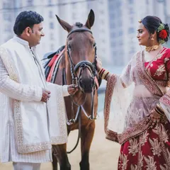 A beautiful, interactive shot of a couple sharing a moment with our horse during their pre-wedding session. These are the candid, heartfelt images that tell a story.