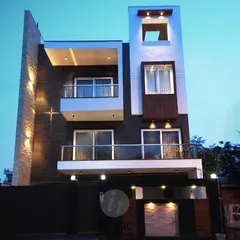 A residence at dusk. I pay close attention to exterior lighting design, as it completely transforms the building's character after sunset, highlighting its architectural forms.