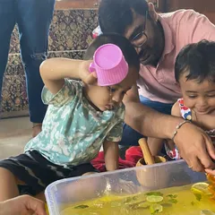 This lemonade-making station was part of our "Little Chefs" theme. The children loved squeezing real lemons into the water and exploring the taste and smell. It's a great multi-sensory activity.