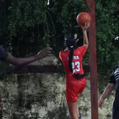 A female player practices her shooting form. We are dedicated to providing a platform for girls to excel in basketball and reach their full potential.
