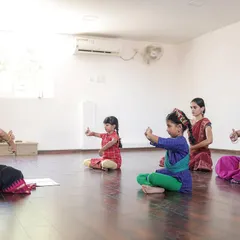 A typical beginner's class at my studio, where young students learn the fundamental postures and hand gestures of Bharatanatyam. I focus on creating a supportive space for them to grow.