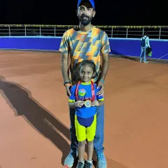 Proud father and coach. Standing with my daughter and her medal after a great performance. We teach kids to be proud of their efforts, no matter the result.