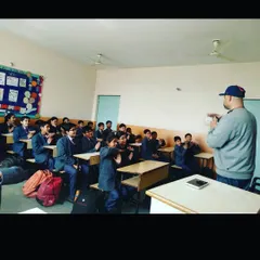 Involving students is the core of my teaching philosophy. Here, I am leading an interactive workshop, getting students to participate directly. This method ensures they remember what they learn because they are a part of the lesson itself.
