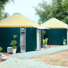 The unique exterior of our yurt-style cottages at Kanakapura, offering a distinctive and private accommodation experience.