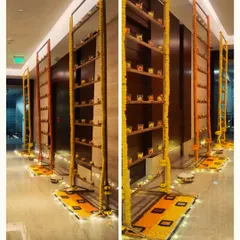 We created these decorative installations in the office hallway, using shelves filled with diyas and framed by marigold garlands to create an immersive and festive pathway for employees.