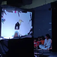 A behind the scenes look at our shadow puppetry segment. The children are completely engrossed as they operate the puppets they created, learning about visual storytelling in a unique and engaging way.