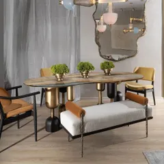 The Dining Bench from our Koko collection merges functionality with artistic design. The combination of soft bouclé fabric, solid teak wood trim, and intricately cast brass legs in a twisted fabric pattern creates a piece that is both comfortable and a true conversation starter.