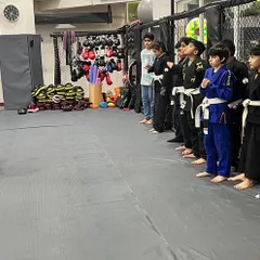 Discipline starts here. Our Little Warriors line up, ready and focused to learn from their coach. This simple act builds respect, attention, and readiness, which are essential skills for martial arts.