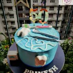 A sweet treat for the professional who fixes sweet tooths. This dentist-themed cake for a 50th birthday includes edible fondant teeth, dental tools, and floss, a fun nod to the recipient's profession.