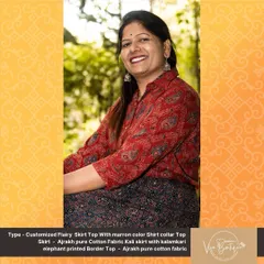 A happy customer wearing her customized flairy skirt and top. The top is made from Ajrakh pure cotton fabric, and the kali skirt features a beautiful Kalamkari elephant printed border.