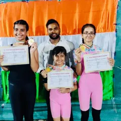 Gold medals for these three champions. I am so proud to stand with them as they show off their awards and certificates from a recent gymnastics competition.
