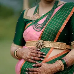 Another detailed shot of the silver belt and the beautiful henna on the mom-to-be's hands, capturing the essence of this special ceremony.