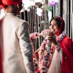 The bride's joyful smile during the Varmala ceremony. We capture the happiness and excitement of this key ritual.