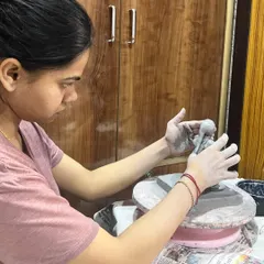 This is me working on a custom Ganesha idol at my wheel. The process is slow and requires a lot of focus, but it's how I ensure every handmade clay sculpture is unique and filled with devotion.