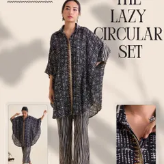 I call this The Lazy Circular Set, for days when you want to feel put-together without trying too hard. It’s crafted in soft cotton silk and pairs an oversized, double-collared shirt with relaxed striped pants. The intricate hand embroidery adds that special touch of artistry.