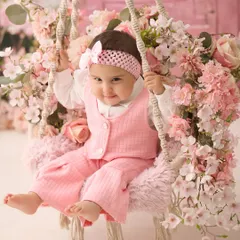 A portrait of sweetness on our pink floral swing. This setup is perfect for creating soft, dreamy, and artistic photos of your baby.
