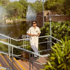 Another look from the Royal Enfield apparel shoot, this time on a wooden walkway by a lake. The scenic background adds a sense of calm and exploration to the brand's image.