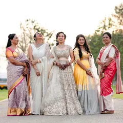 The bride sharing a laugh with the wonderful women in her family. These are the moments of connection and shared joy that make a wedding special.