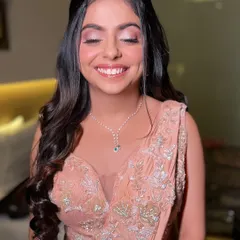 Her joyful expression says everything. The soft glam makeup enhances her natural beauty and happiness, making her shine on her special evening.
