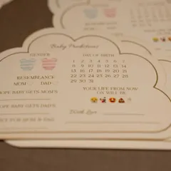 These custom cloud-shaped 'Baby Predictions' cards are a sweet and interactive keepsake. Guests can write their wishes and guesses for the parents-to-be to read and cherish later.