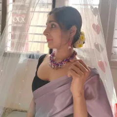 Here I am modeling the braided thread necklace, showing how it can elevate a simple saree. The combination of colors and textures makes it a versatile accessory.