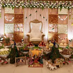 A classic and grand Seemantha decoration, featuring a unique backdrop made of assorted dry fruits. The setup is completed with my signature 21-plate arrangement, thematic dolls, and peacock figures for a rich, traditional feel.
