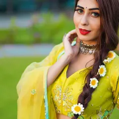 A closer look at the hand-embroidered blouse from the lime-green lehenga set. The intricate floral details and subtle sequin work add a touch of traditional craftsmanship to this modern, vibrant outfit.
