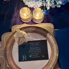 The details of a place setting at one of our elegant sit-down dinners. A personalized thank you note for the guests adds a thoughtful and luxurious touch to the experience.