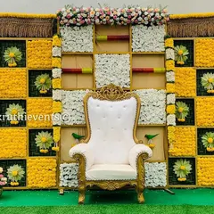 This vibrant checkerboard backdrop is one of our most requested designs. We use fresh marigolds, chrysanthemums, and woven palm leaves to create a bright and auspicious setting perfect for any celebration.