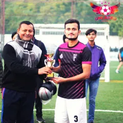 A player from the runner-up team receives his trophy. I believe in recognizing the effort of all top performers, not just the final winners.