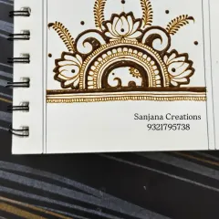 This step shows how to add details like leaves and swirls to connect the main elements. Learning these small connecting patterns is key to creating a full, flowing design.