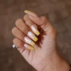 Another view of the yellow ombre floral nails, showing how they look when worn.