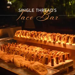Welcome to the Single Thread Taco Bar, a guaranteed highlight of any party. We line up freshly made tortillas, ready to be filled with your choice of slow-cooked meats and vibrant salsas, creating a lively and interactive taqueria experience.