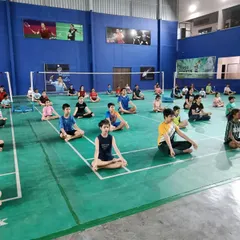 Our players in a seated meditation pose during a yoga session. This practice helps develop the mental concentration needed to stay focused during long and challenging matches.