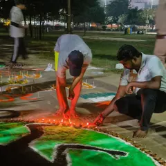 Teamwork makes the dream work. My students and I lighting the diyas together for our special Diwali rangoli.