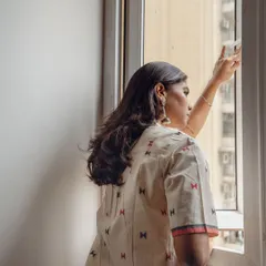 A different angle from the window series, focusing on the back and side profile. This helps showcase the garment's fit and fabric from multiple viewpoints for potential customers.