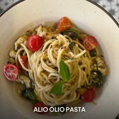 A closer look at my Aglio Olio pasta, a simple yet flavorful dish. It's tossed with roasted broccoli, cherry tomatoes, and fresh basil for a nourishing, satisfying meal.