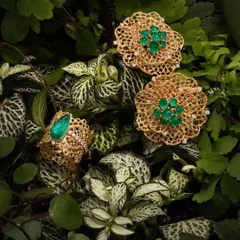 A collection from my 'Forest' series, photographed amongst lush greenery. This set includes large floral eartops and a matching ring, all crafted in 18k gold lace and set with ethically mined Zambian sugarloaf emeralds.