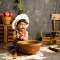 Welcome to my studio, where we cook up the cutest memories. This little chef was an absolute star during his creative themed photoshoot, showing off his delightful personality.
