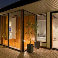 We designed this executive suite in Delhi to be a true retreat. The private bedroom opens directly onto a lush terrace garden, creating a seamless transition between work, rest, and nature. The space is designed for serenity and indulgence, especially during quiet evenings.