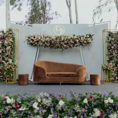 A perfect example of modern minimalism, this stage uses clean lines, a muted color palette, and elegant floral structures. The design creates a chic and sophisticated focal point for a contemporary engagement or reception.