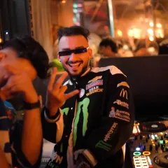 Rocking a motorsport jacket at a New Year's event. My fashion is part of the performance.