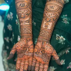 The next-day stain of a full bridal mehendi. The details are crisp, and the color is developing into a beautiful deep maroon.