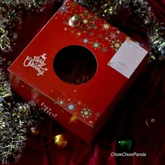 The festive packaging for my Christmas plum cakes. Each cake comes in this beautiful red box with a window, making it a perfect holiday gift.
