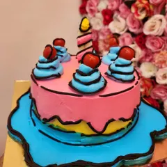 This 2D cartoon cake is designed to look like a drawing. The bold black outlines create a fun, comic-book effect that's very popular and visually striking.